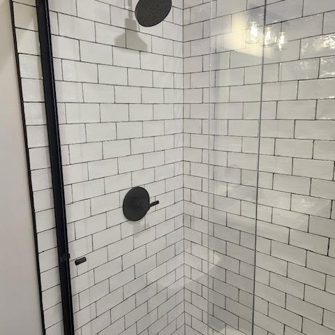 Bathroom remodel with Virginia Tile Crafted Gloss 3x6 in White on the shower walls with Shaw Revival Aurora in Opal across the bathroom floor in Edwardsville, IL