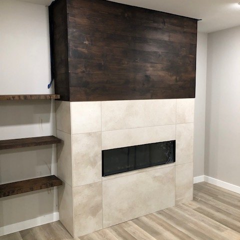 Basement fireplace with Virginia Tile Modern Formation Peak White tile
