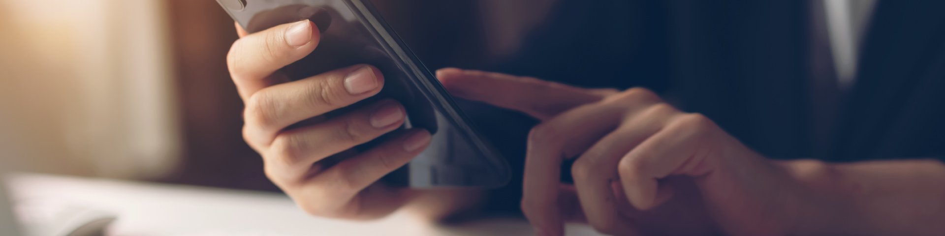 person using phone - Vallow Floor Coverings in Edwardsville, IL