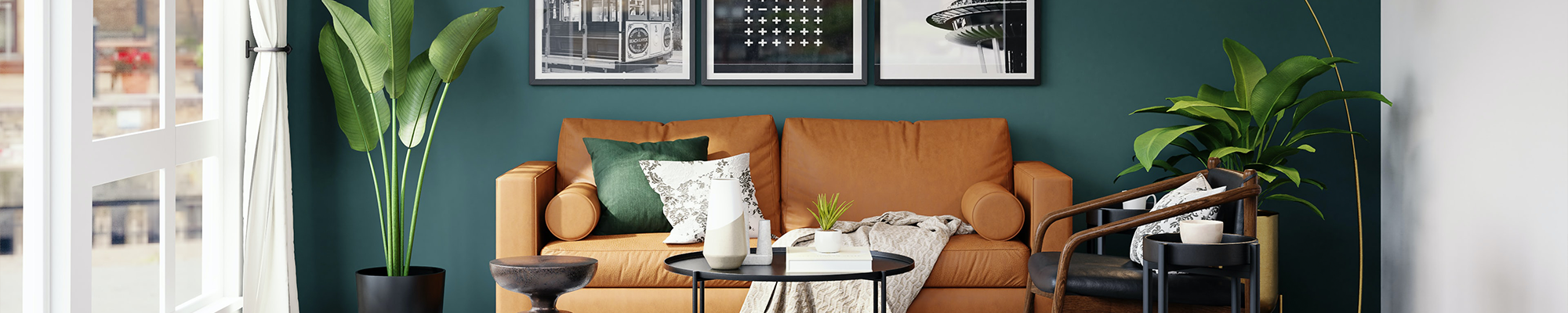living room with orange couch and houseplants with pictures on the wall from Vallow Floor Coverings in Edwardsville, IL